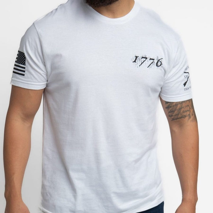 White t-shirt with 1776 design on a plain background