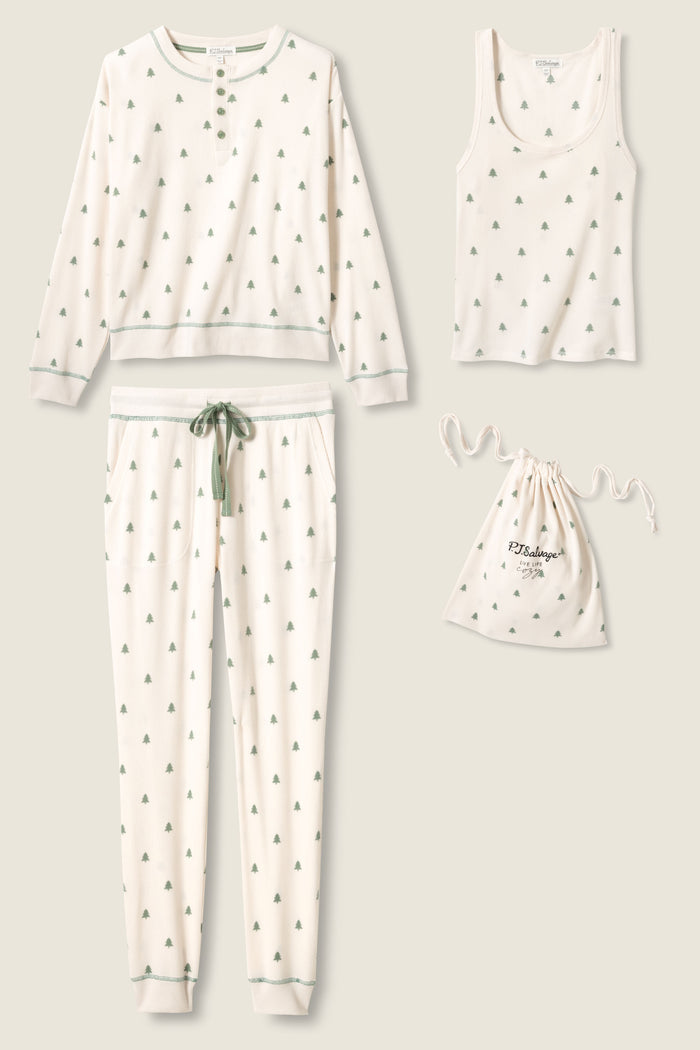 The P.J. Salvage 4-Piece Tree Print Thermal Lounge Set includes a cream pajama top, drawstring pants, sleeveless tank, and matching bag—ideal for a cozy winter night or your next cabin getaway.