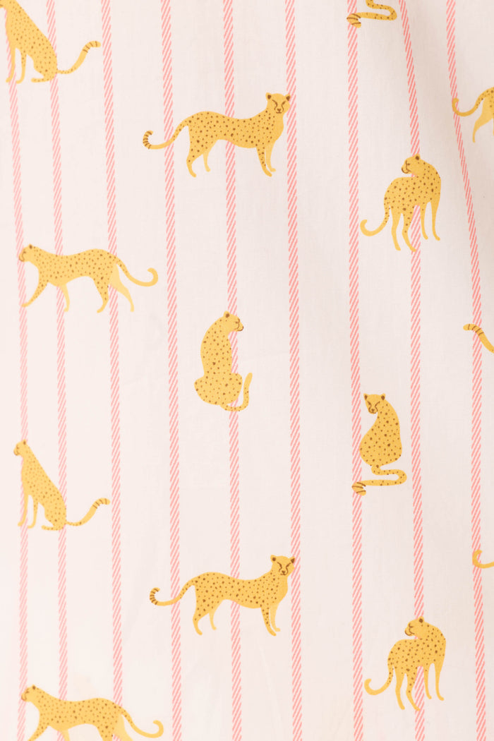 The Afterparty Poplin Cheetah Charm Short PJ Set by P.J. Salvage features white cotton with playful yellow cheetahs layered over diagonal sunset rose stripes—a fun twist on classic pink cheetah print pajamas.