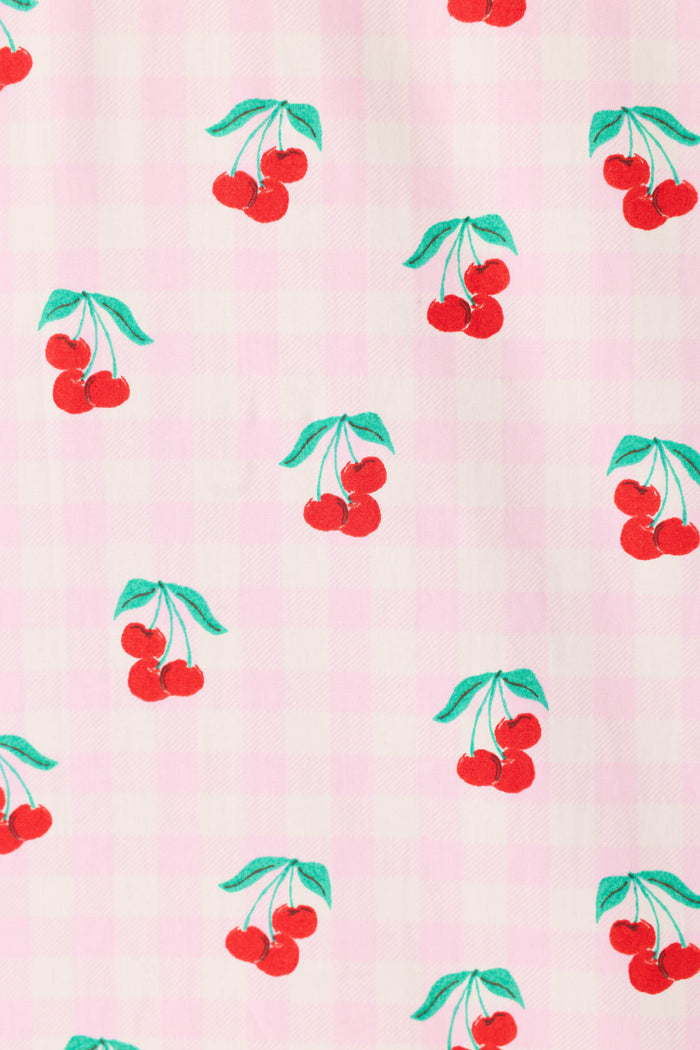 The Afterparty Poplin Oh Cherry Short PJ Set by P.J. Salvage features a playful red cherry print with green leaves on a light pink and white checkered cotton poplin, offering a charming and fresh sleepwear choice.