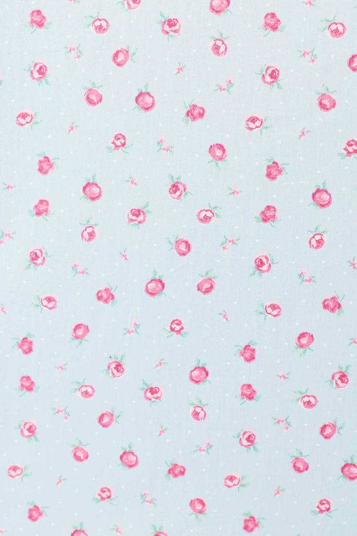 The Afterparty Poplin Rosy Nights Short PJ Set by P.J. Salvage features a light blue background with small pink roses, green leaves, and subtle white dots, printed evenly on soft cotton poplin—perfect for stylish comfort.