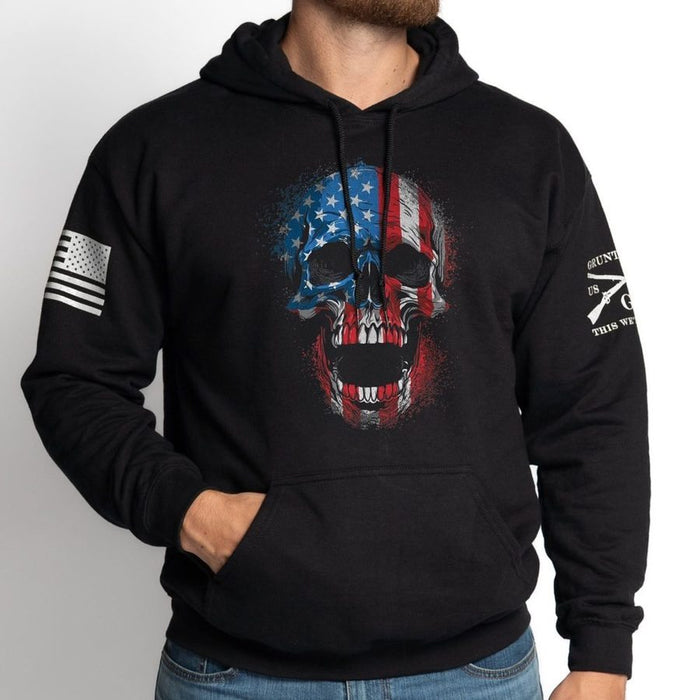 Black hoodie with skull design and American flag, worn by a person on a white background