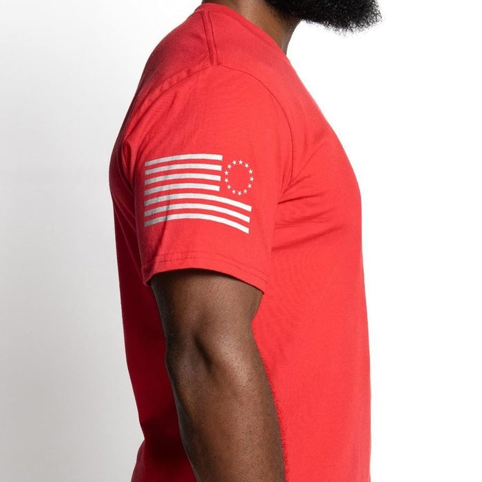 Red t-shirt with a white flag design on a white background
