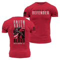 Red t-shirt with 'Blessed of the Defender' text on front and 'Faith Built This Blood Defends It' on back, on a white background.