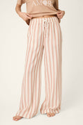 Pink and white vertical stripes on a lightweight, loose-weave fabric; soft texture with a drawstring threaded at the top edge.