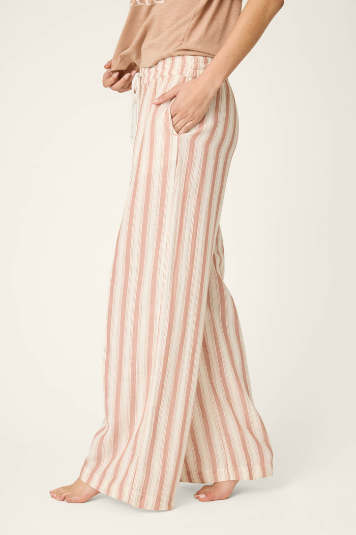Vertical stripes in beige, white, and pink on a loose, soft fabric; smooth texture with visible drawstring ties.