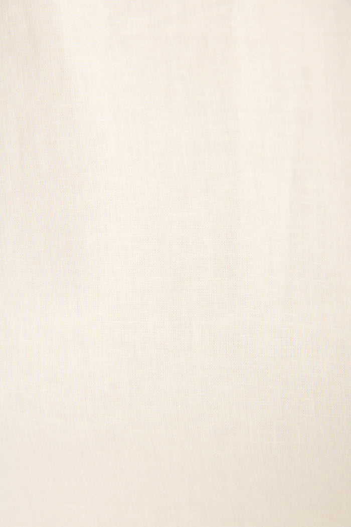 Light beige fabric with a subtle visible weave and smooth texture.