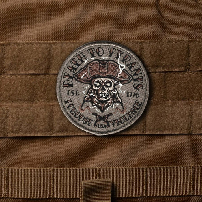 Patch with skull design and text on a brown tactical vest