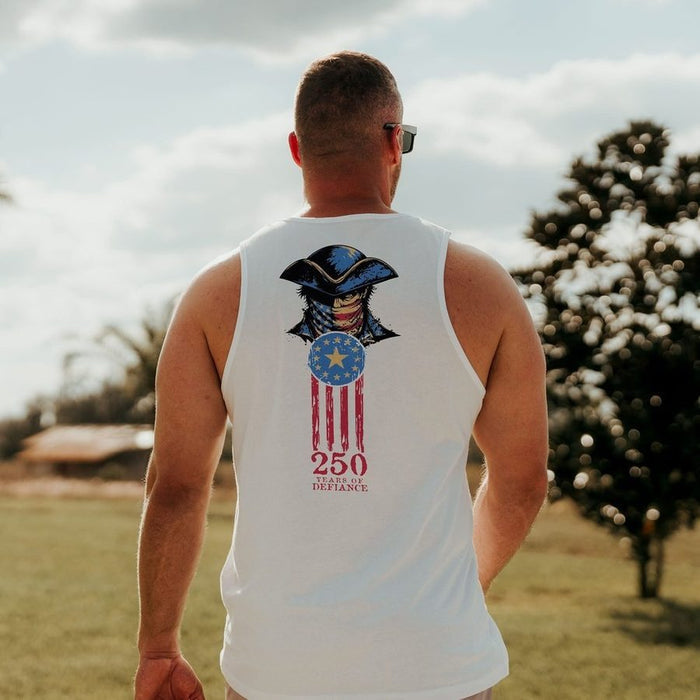 Man wearing a white tank top with a graphic design outdoors