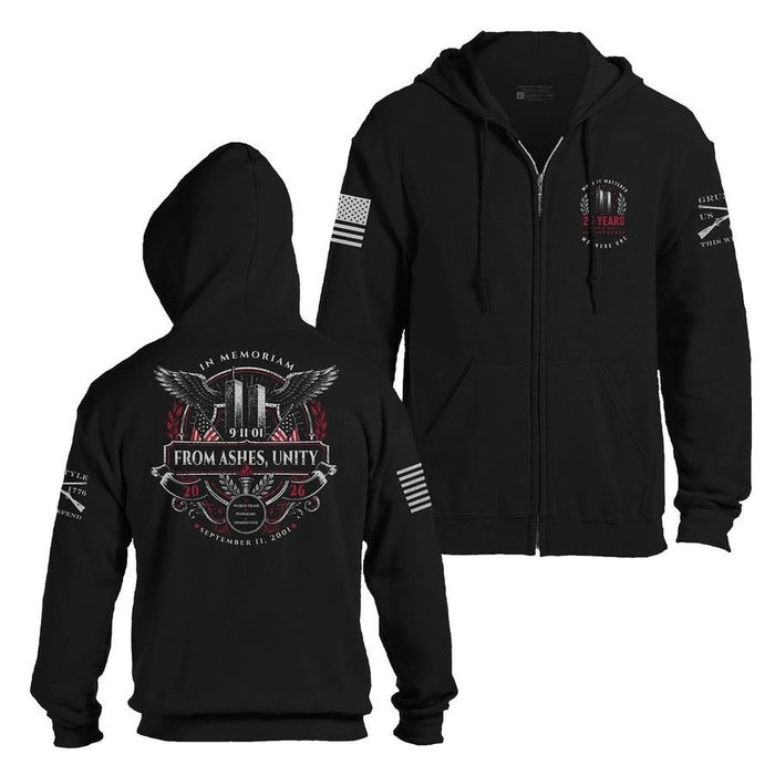 Black zip-up hoodie shown from the front and back on a white background. The front features a front zipper, drawstring hood, kangaroo pockets, a small circular chest graphic, and flag-style sleeve prints.