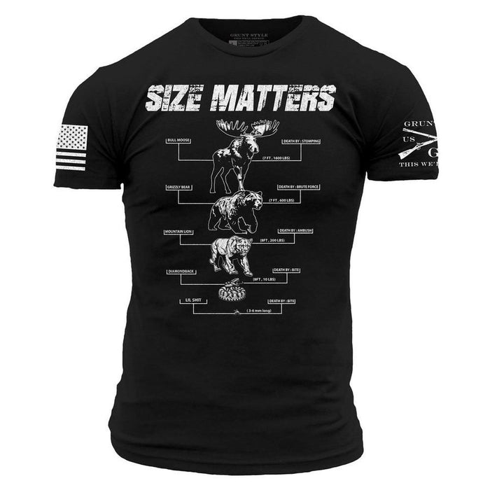 A black short-sleeve t-shirt with a white graphic print showing the progression of military aircraft sizes, topped with the text 'SIZE MATTERS'. The left sleeve features a distressed American flag graphic, and the right sleeve has text reading 'GRUNT US THIN WE'.