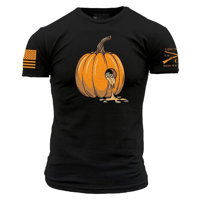 A black short-sleeve t-shirt with a graphic of an orange pumpkin on the chest, with a small skull inside the pumpkin and orange dripping details. The left sleeve features a distressed orange American flag, and the right sleeve has orange text and crossed rifles.