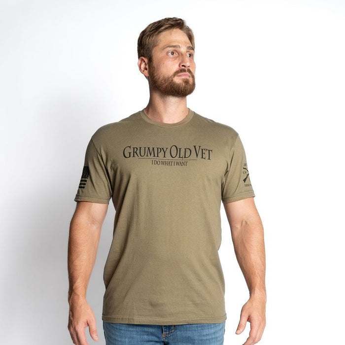 Man wearing a green t-shirt with 'GRUMPY OLD VET' text on a white background