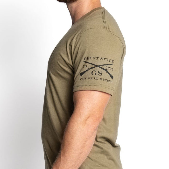 Person wearing a green t-shirt with 'Grunt Style' logo on a white background