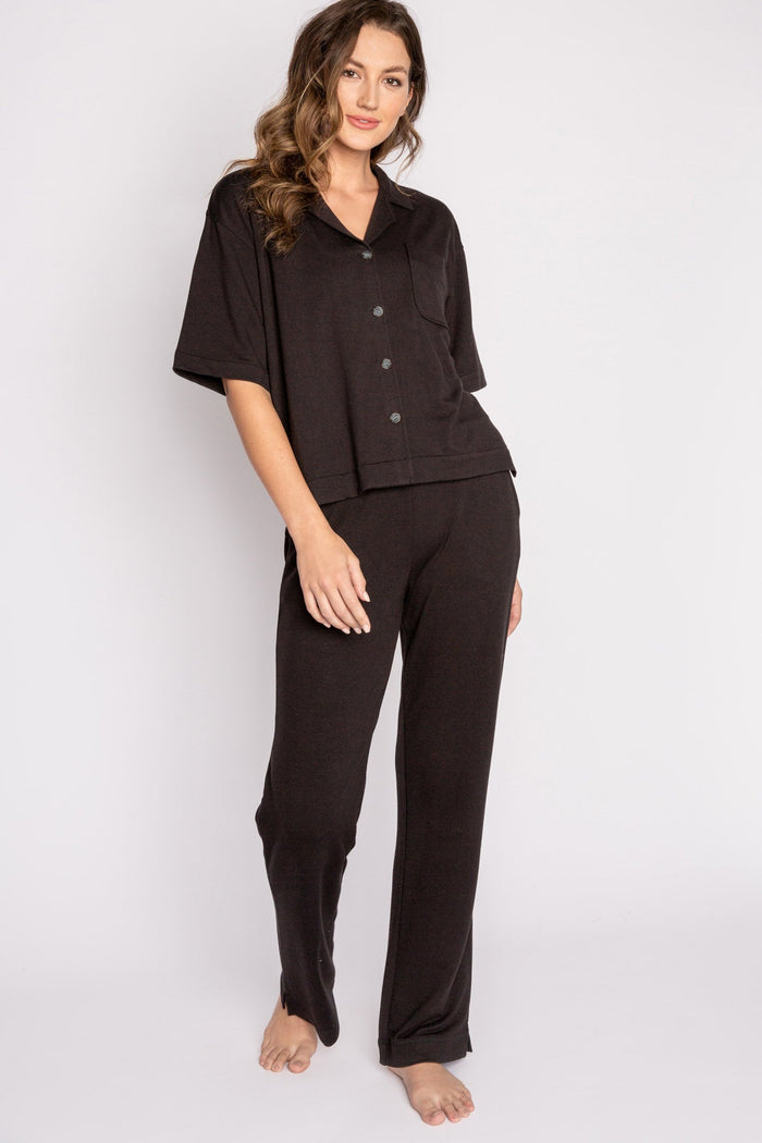 Black terry lounge set with short sleeve button-down top and tie waist pants. (7125203714148)