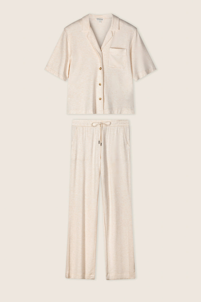 The Jammie Essentials PJ Set by P.J. Salvage, in light beige baby terry knit, includes a short-sleeve button-up shirt with a chest pocket and drawstring pants with side pockets, both shown flat on a neutral background.