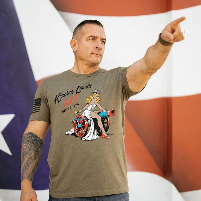 Man wearing a t-shirt with a graphic design in front of an American flag