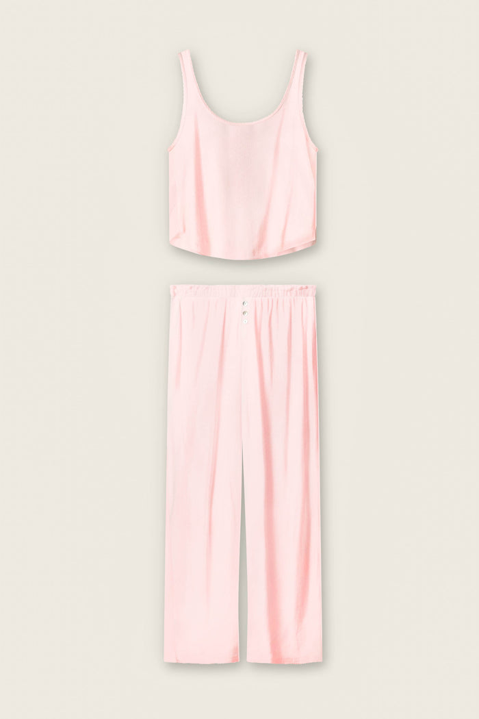 The P.J. Salvage Pointelle Essentials Ballet Pink PJ Set features a light pink satin two-piece with a sleeveless crop top and matching high-waisted, wide-leg pants with an elastic waistband, shown on a plain light background.