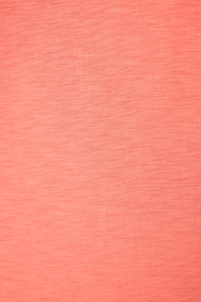 Close-up of coral pink fabric with smooth surface, subtle woven texture, and visible horizontal and vertical thread lines.