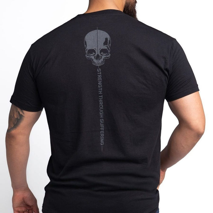 Black t-shirt with skull design and text on the back, worn by a person.