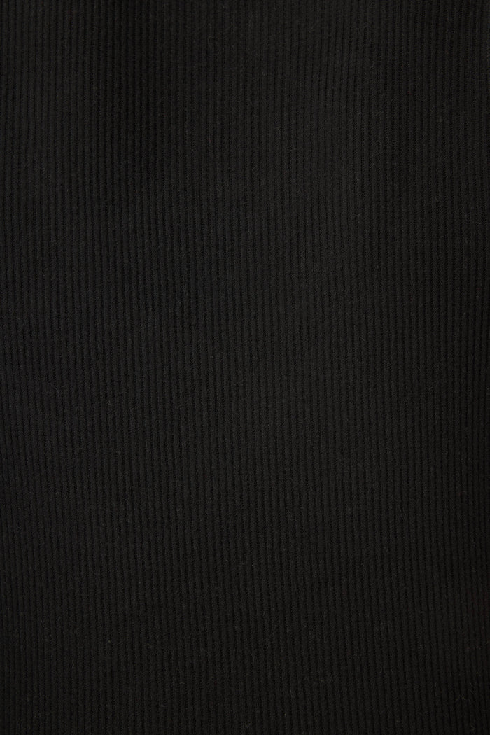 A close-up of the black ribbed fabric texture from Textured Essentials by P.J. Salvage, showcasing vertical lines and soft folds.