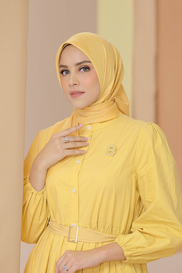 the tapis square scarf in banana cream by buttonscarves front view
