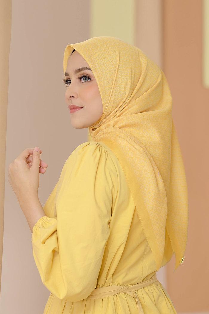 the tapis square scarf in banana cream by buttonscarves side view