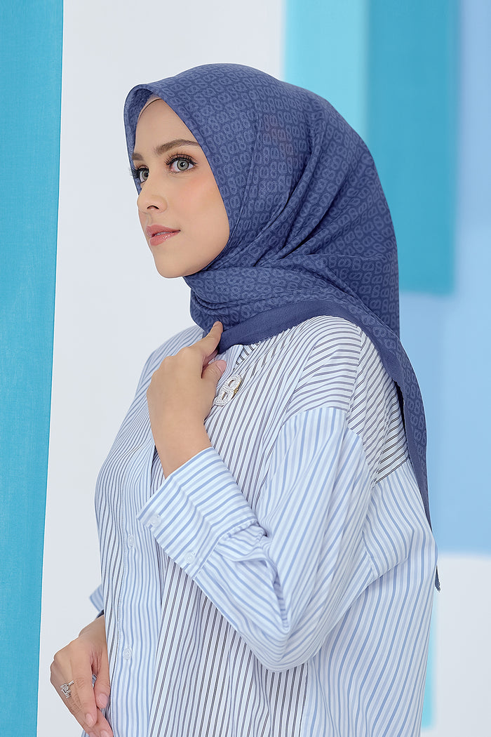 the tapis square scarf in sodalite blue by buttonscarves side view