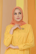the tapis square scarf in tangerine by buttonscarves front view