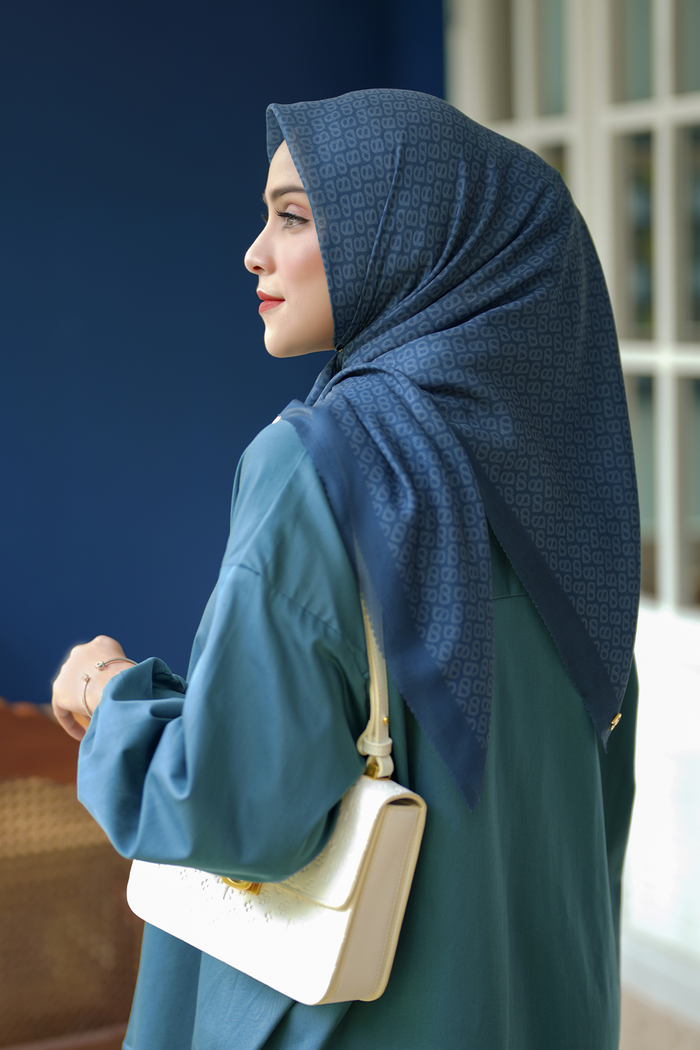the tapis square scarf in teal by buttonscarves