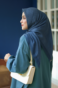 the tapis square scarf in teal by buttonscarves