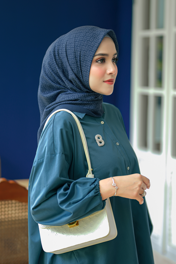 the tapis square scarf in teal by buttonscarves side view