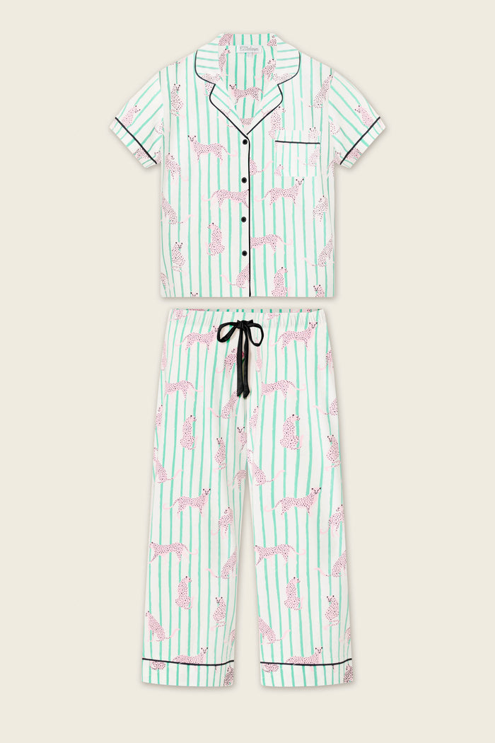 The Whimsy Cool Cat Cropped PJ Set by P.J. Salvage features a short-sleeve button-up top and long pants in white with light green stripes and pink cheetah print, plus a black drawstring waist.