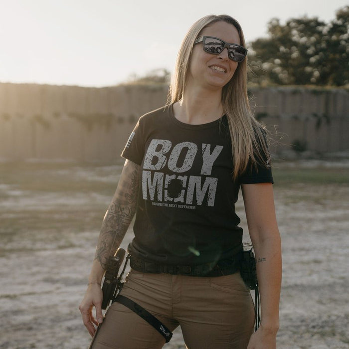 Woman wearing a 'BOY MOM' t-shirt outdoors