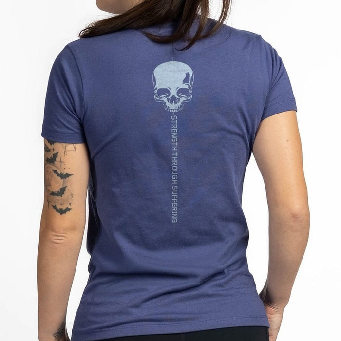Person wearing a blue t-shirt with a skull design and text on the back.