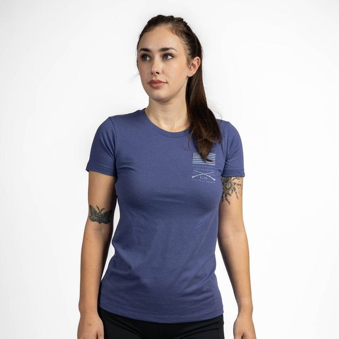 Woman wearing a blue t-shirt with a logo on a white background