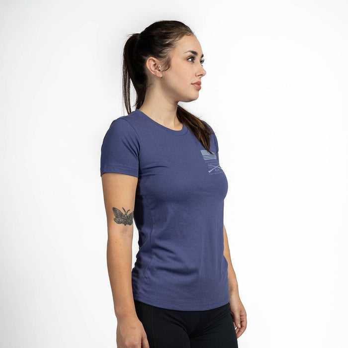Woman wearing a blue t-shirt with a logo on a white background